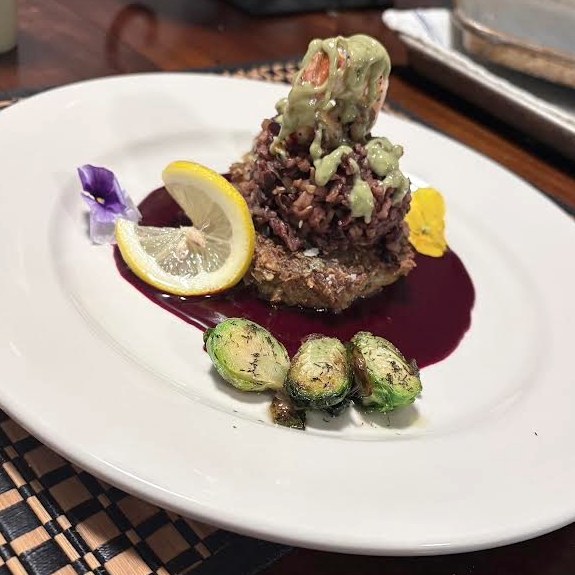 Shrimp with purple rice, brussels sprouts, and wine reduction