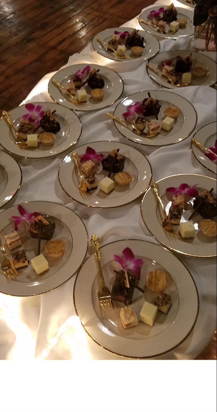 Signature dessert plates with gold-rim china and orchid garnish