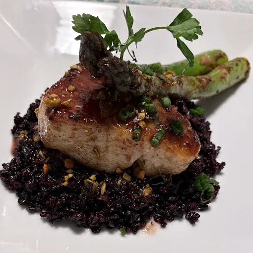 Glazed pork chop on black rice